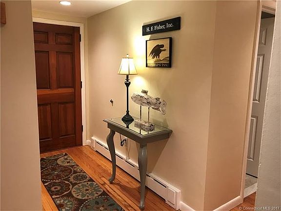 Inviting foyer with hardwoo...