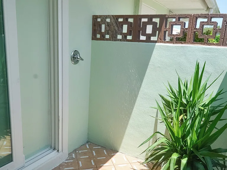 Outdoor shower off of master bathroom. Private, but accessible from outside as well. Great for washing sand from the beach