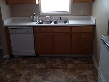 Kitchen area with dishwasher.