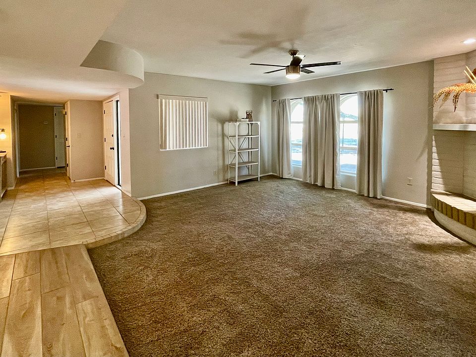Living room with fireplace and front entry way