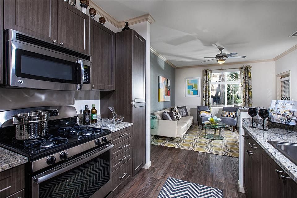 Kitchens feature gas stovetops and granite countertops