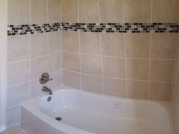 Beautifully tiled bathtub surround