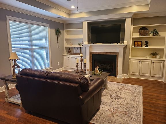 Living Room: Custom built-in shelves and mantle. Nice double window.
*Furniture and decor not included