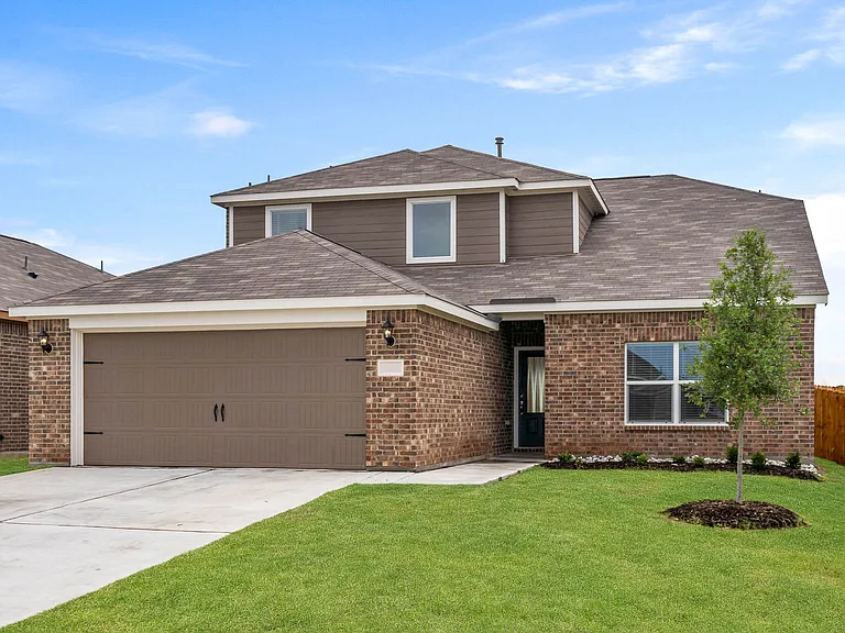 The Cypress is a beautiful two-story, brick home with siding details.