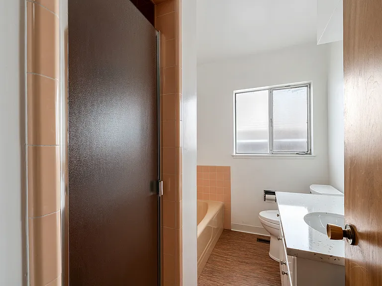 Hall Bathroom with bathtub and separate shower.
