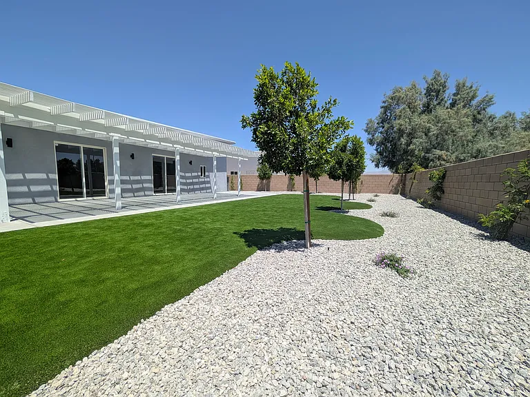 Fully landscaped with trees to provide more shade