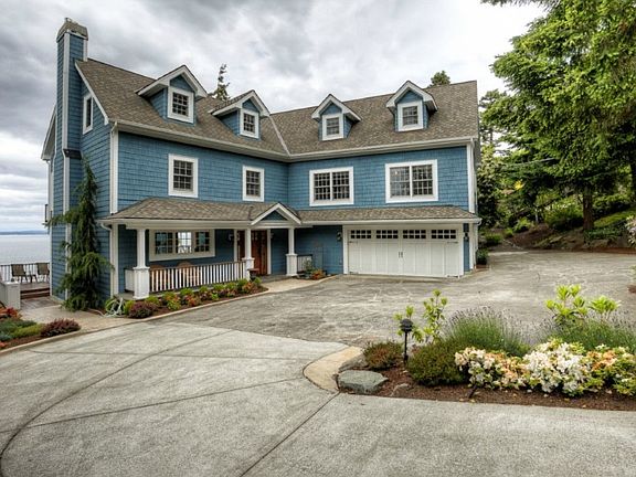 The large circular driveway leads to a 2-car attached garage with shop area, and offers 10+ additional parking places. 3 amazing view levels and a view daylight basement present some of the most spectacular westerly views that Seattle has to offer.