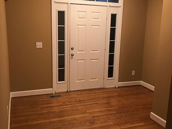 Entry foyer. Hardwood floors through kitchen and breakfast area
