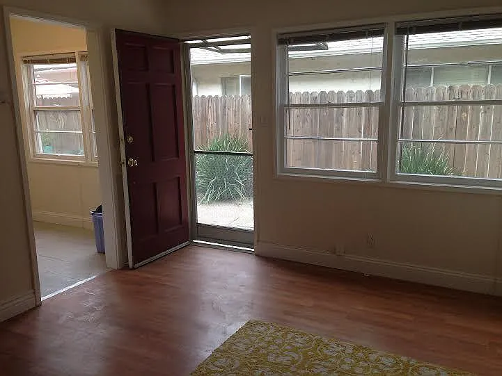 Windows from the living room looking out to the entrance walk way. - 805 Howard St