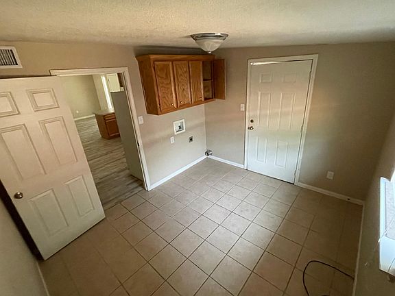 laundry room/mudroom with access to the backyard