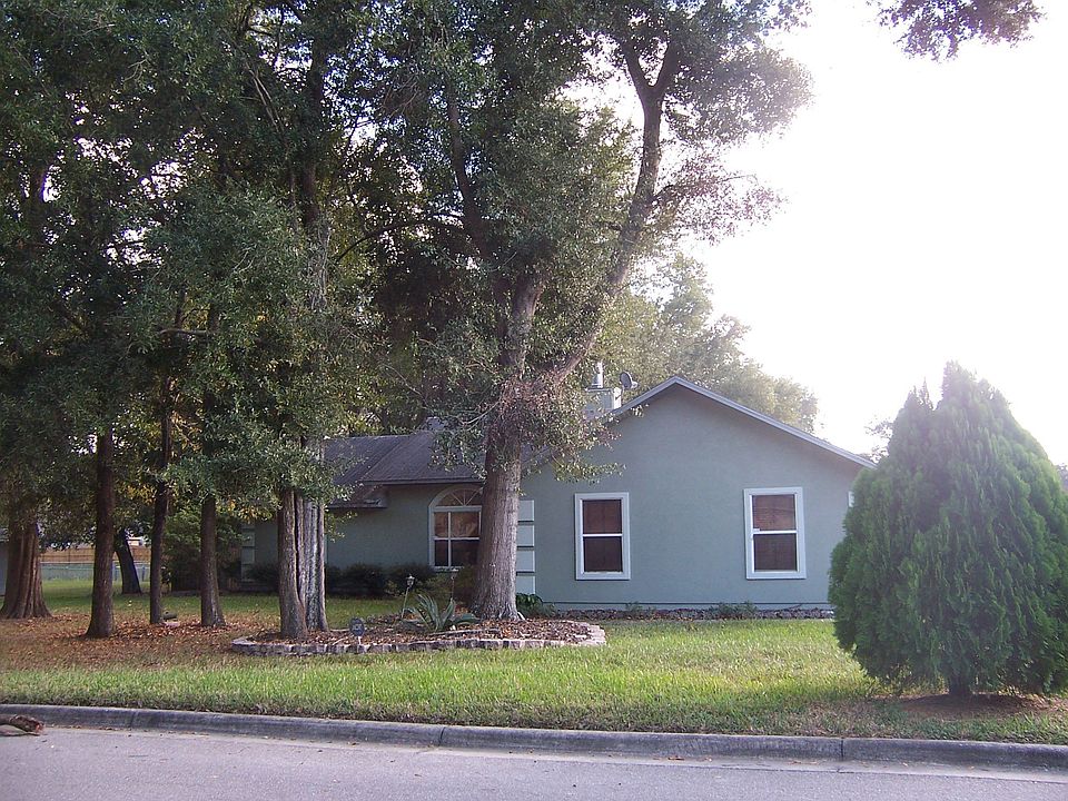 Front view, fenced back yard