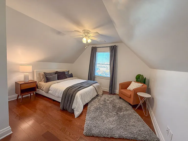 Bedroom with queen-size bed and spacious closet