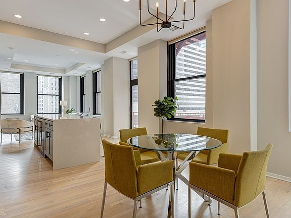 Dining area + center island + living room corner view