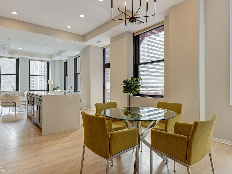 Dining area + center island + living room corner view