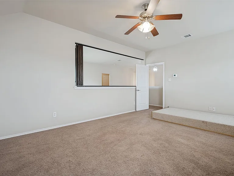 Is open to living space or may be closed off with custom sliding shutters
