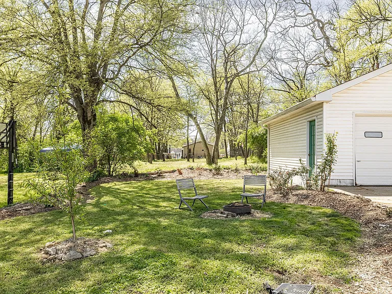 peach tree, thyme, and roses are just a few of the edible things in this garden. In addition, there's a 12x4 vegetable garden bed ready for you to plant!