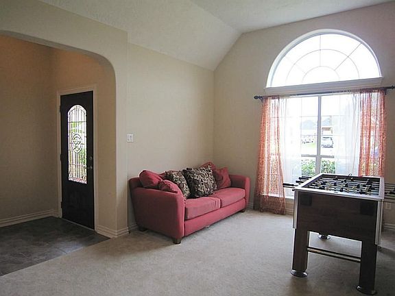 Floor to ceiling window with rounded corners and archways.