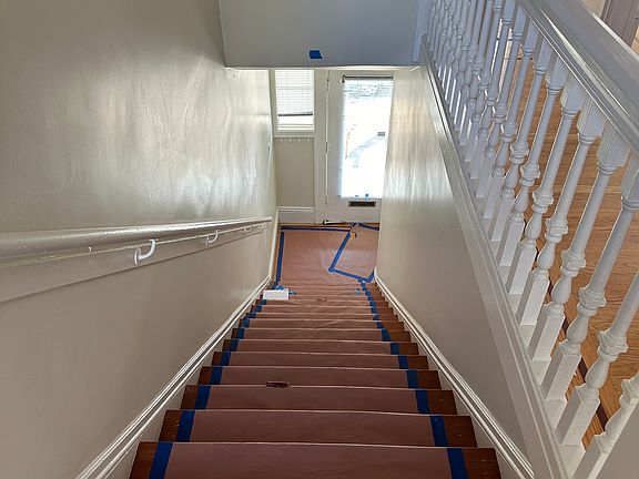 Inside interior stairs.