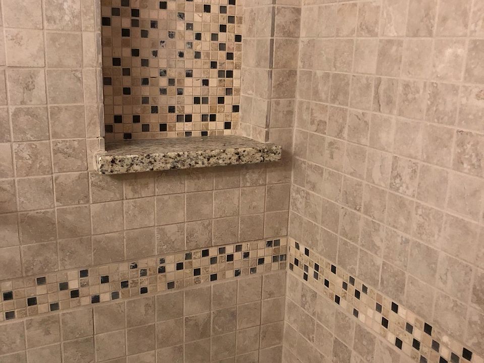 Newly tiled shower in main bathroom