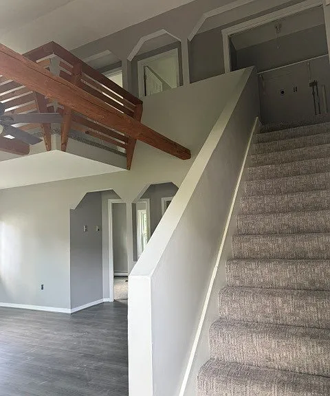 Front door looking up to the second floor bedrooms and laundry room at the top of the stairs.