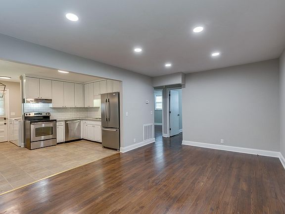 View of the living room and eat-in kitche.