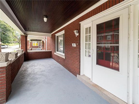 An expansive front porch is inviting for guests and the perfect place to enjoy the private no outlet street.
