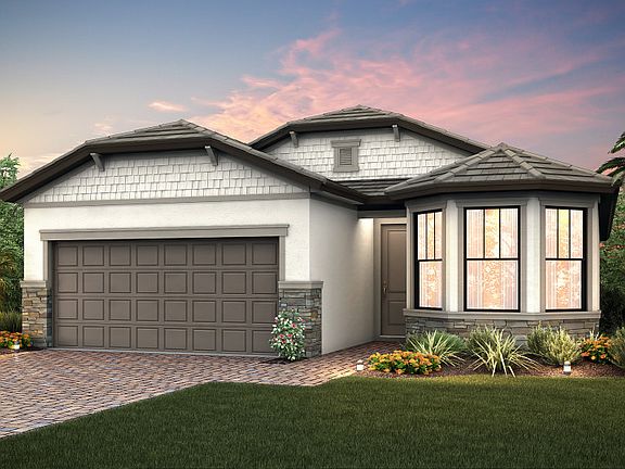 The Wyndham, a one-story family home with a 2 car garage, shown with Home Exterior C2B