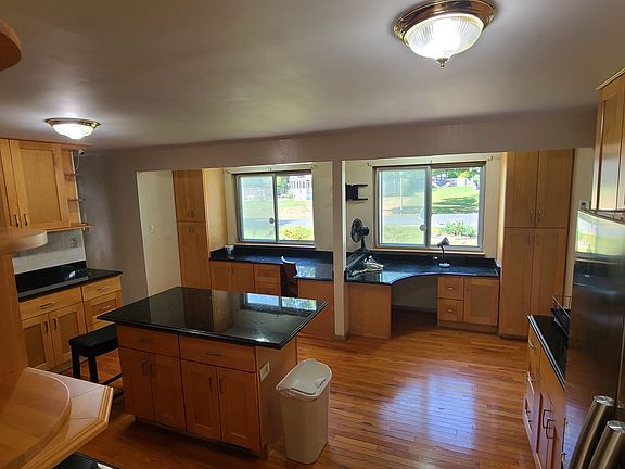 Kitchen with built in desk area and central island