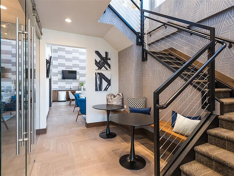 Sleek staircase leading into the common resident area