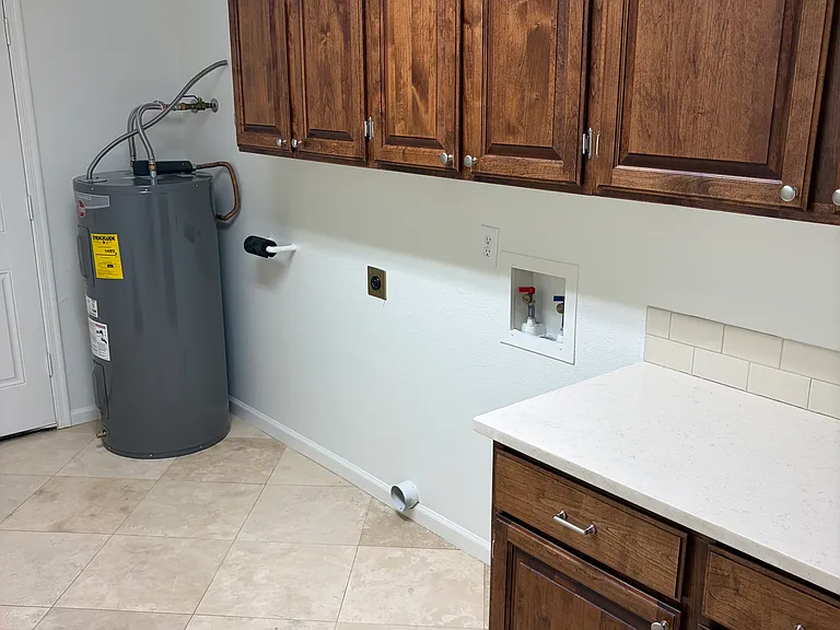 Large Laundry Room with Storage and Brand New Water Heater