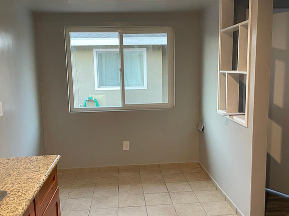 Kitchen There's room for Stacked Washer/Dryer at end of counter on left. Many tenants put small kitchen table on right far corner.