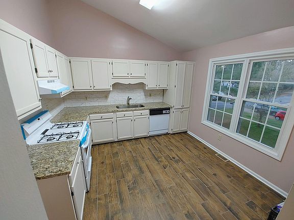 Brand New Granite countertops, New Sink, New pull-out Faucet, new Stove and vent hood, Brand new floor tile, brand new tile backsplash