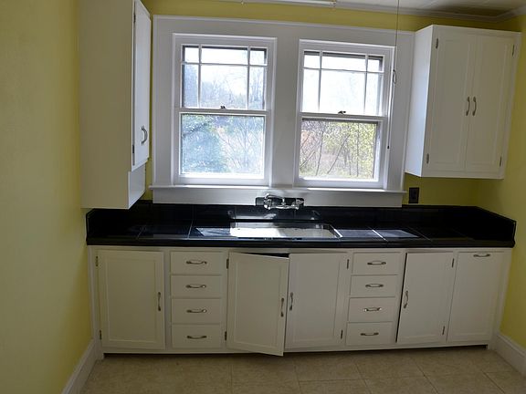Kitchen with black marble countertop.