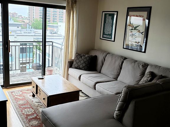 Living room can accommodate sectional sofa.