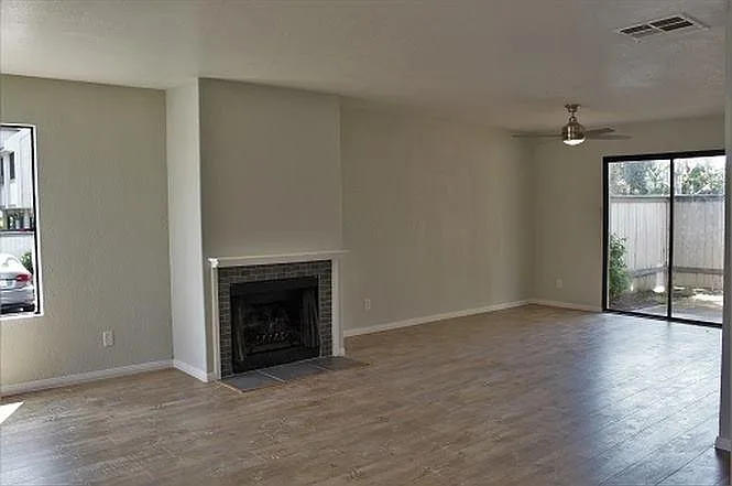 Gas fireplace, sliding glass door to patio