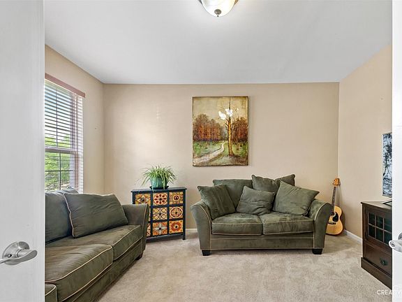 french doors open to den/office space