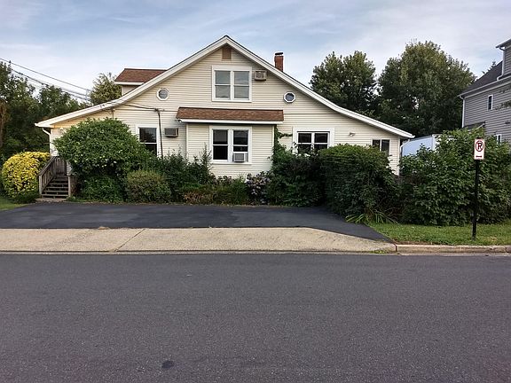 Eighth Street side of house. Driveway is to the right of house.