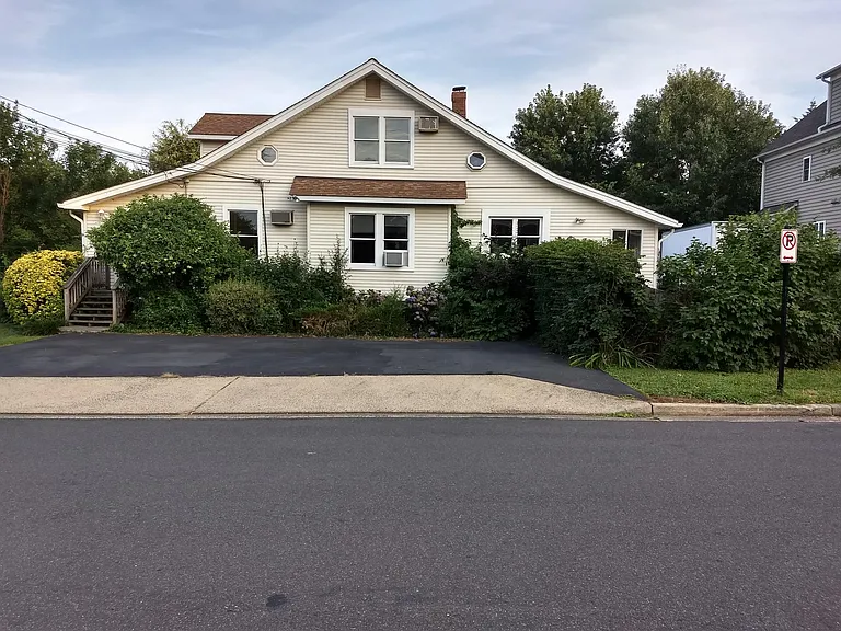 Eighth Street side of house. Driveway is to the right of house.