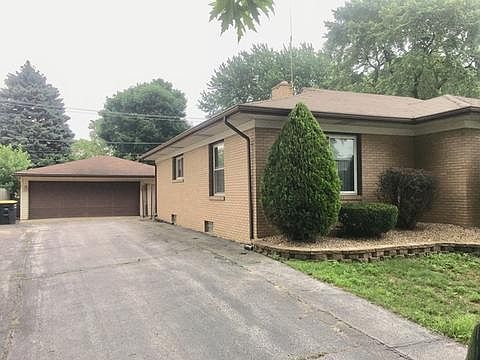 Two car garage and a wide well maintained driveway