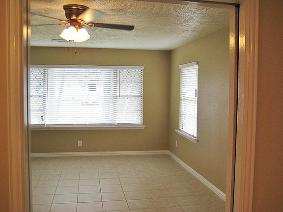 Looking into the living room from the dining room. The windows really make this room inviting.