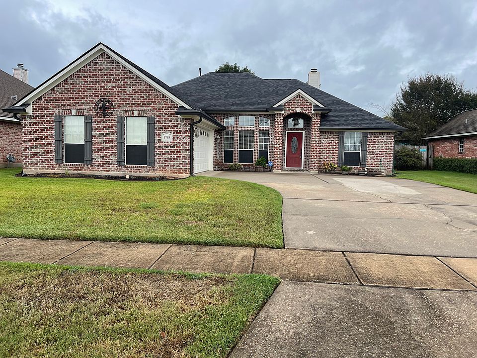 Welcome home 

Flower beds & eight vehicle driveway