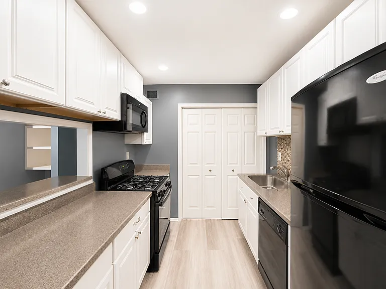 Kitchen facing washer and dryer closet