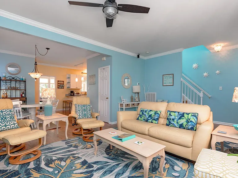 Here's a view from the family room. You can see the entry and stairs to the second floor, the dining area, and a bit of the kitchen.