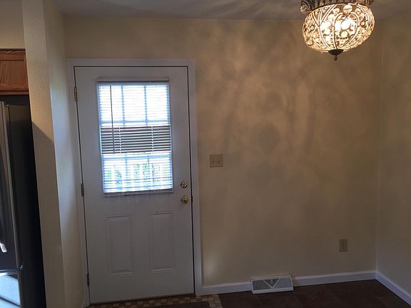 Dinning Room With Backdoor Leading to Deck