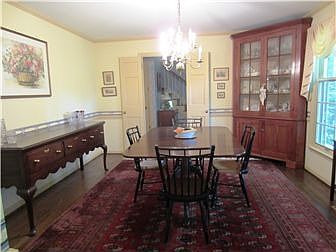 Large formal dining room with chair rail