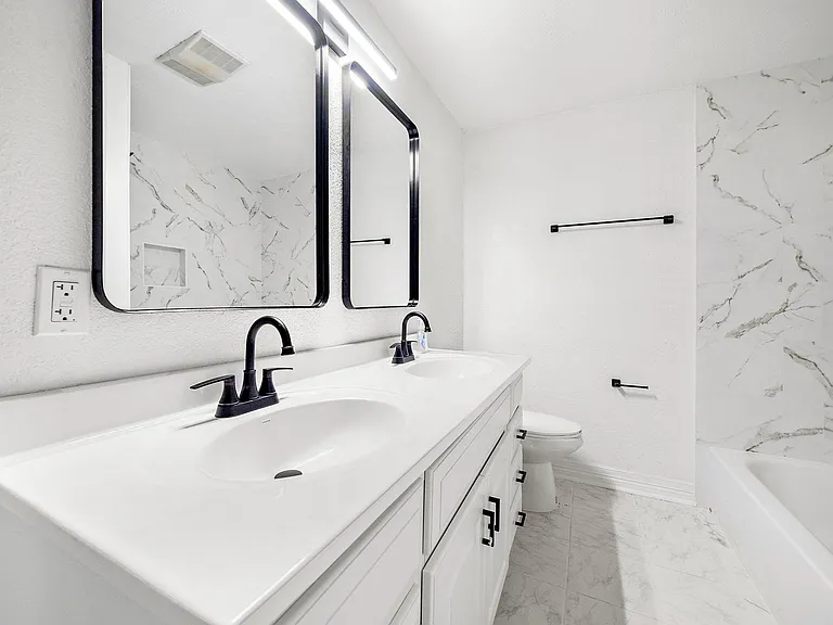 Shared hallway bathroom 1 w/o window.