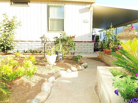 Custom walk way with stone and brick planters