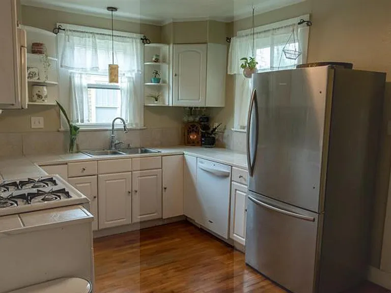 Kitchen with gas stove, dishwasher and fridge