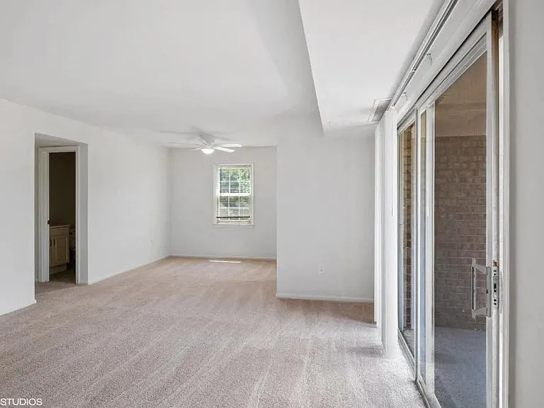 Spacious living area with sliding doors to the patio