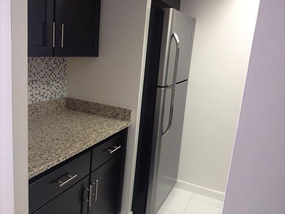 Granite c/tops with S. Steel Fridge